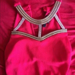 Red dress with sliver rhinestones and gold.